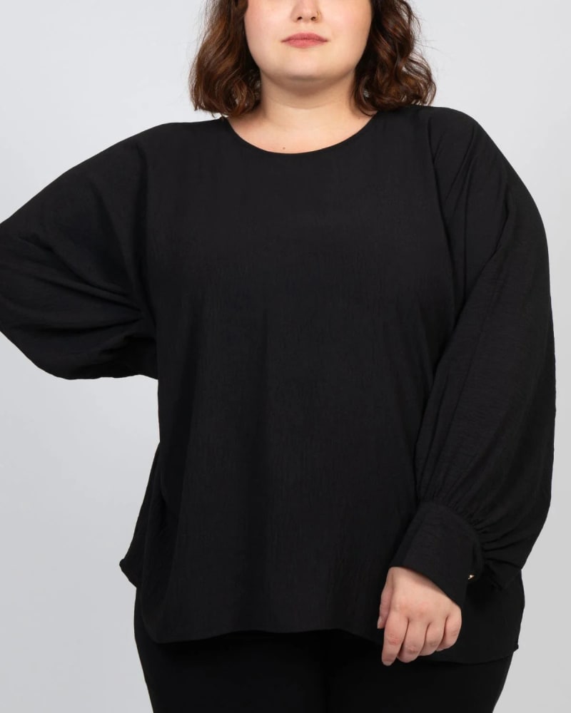 Front of a model wearing a size 1X Eloise Oversized Blouse Long Sleeves Solid in Black by ANNICK. | dia_product_style_image_id:315360